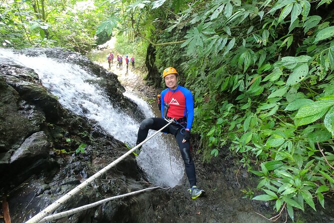 Fun Canyoning in Gitgit Canyon - Entering the gorge through slides and jumps