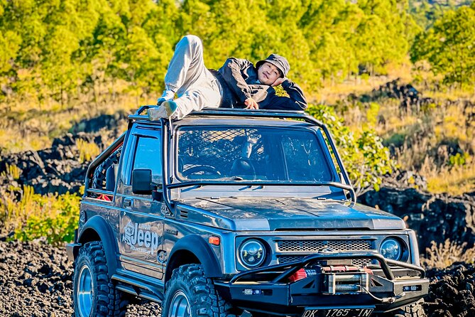 Mount Batur Jeep Sunrise and Natural Hot Spring Tour - Riding a jeep toward the sunrise