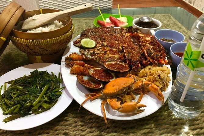 Romantic Seafood Dinner at Jimbaran Beach Bali include Sunset - Watching the sunset from a table on the sand