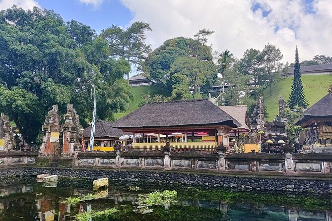 Ubud Tirta Empul Temple Tour with Purification Experience - Bathing beneath the sacred fountains