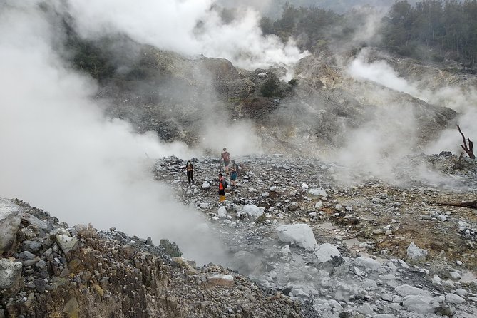 volcano hike and jungle trekking adventure - Swimming beneath a natural waterfall